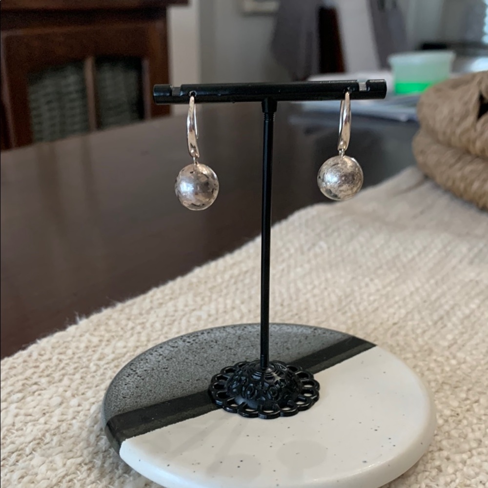 Elegant Sterling Silver Earrings with antique ball appearance.